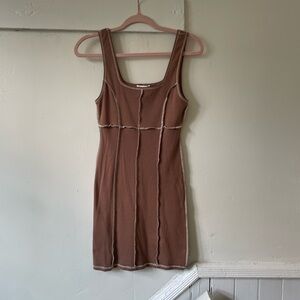 Tilly bodycon dress in tan with white stitching.